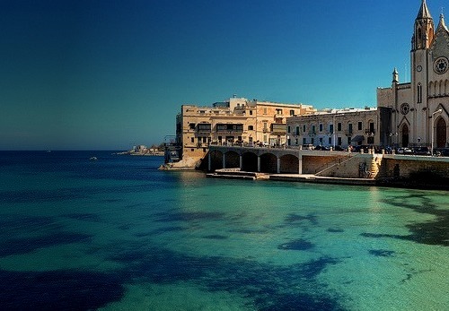 The turquoise waters of Balluta Bay in Silema, Malta